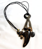 Necklace made with large black horn tooth pendant
