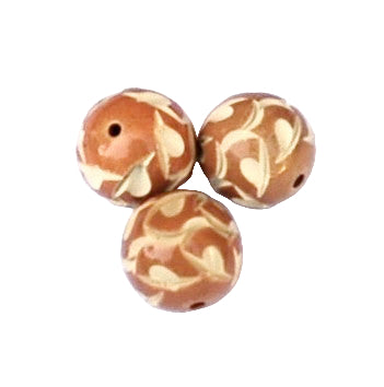 Carved caramel celluloid round beads