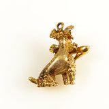 Gold and ruby poodle with shoe charm