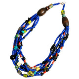 A multi-strand beaded necklace featuring vibrant African royal blue padre beads, large dark brown wooden beads, and small colorful accent beads in yellow, green, black, and red,