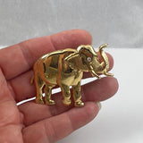Gold elephant brooch

