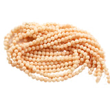 Angel Skin Coral Round Beads