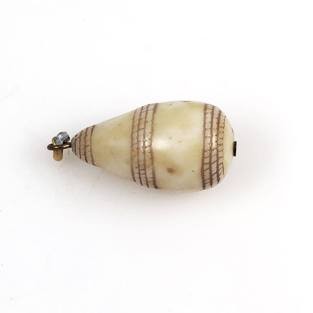 Vintage carved bone pendant
