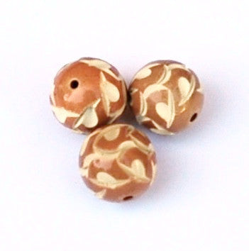 Carved caramel celluloid round beads