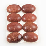 Goldstone oval cabochons