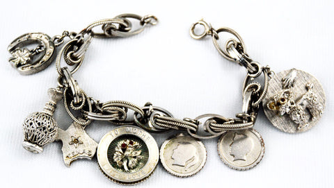 Monet Silver Tone Loaded Charm Bracelet