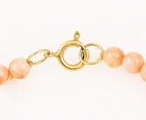 Gold spring ring on Vintage Pink Coral, Pearl & 14K Gold Bracelet