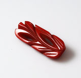 Red Bakelite Art Deco Carved Pin