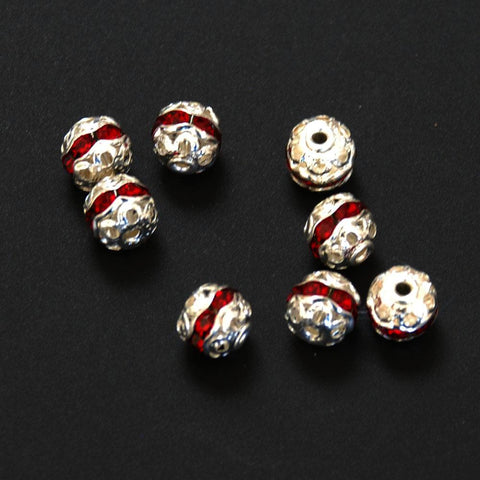 Silver filigree and red crystal beads