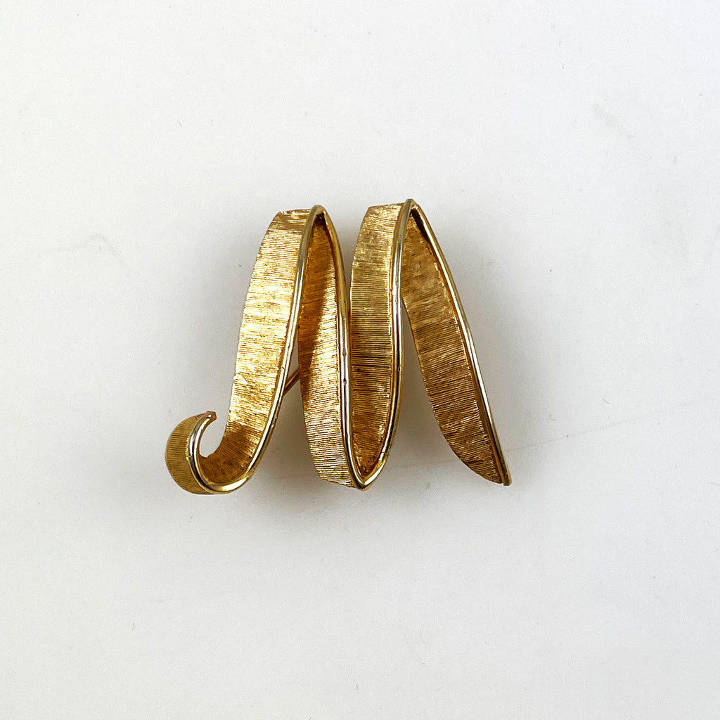 M brooch deals